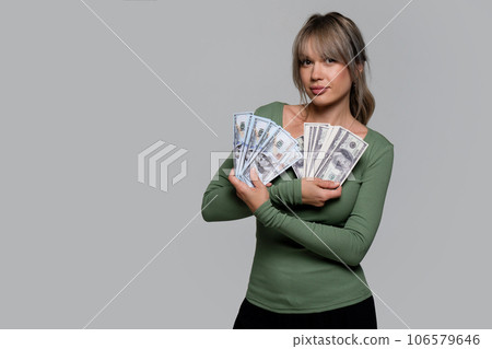 Woman hands holding cash money of dollars. Cash profit Woman hands holding cash money of dollars. Cash profit 106579646
