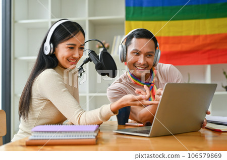 Positive gay male podcaster and his female friend, recording conversation for channel LGBT, friendship and lifestyle concept Positive gay male podcaster and his female friend, recording conversation for channel LGBT, friendship and lifestyle concept 106579869