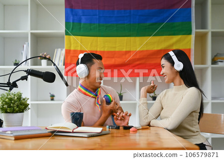 Positive gay male podcaster and his female friend, recording conversation for channel LGBT, friendship and lifestyle concept 106579871