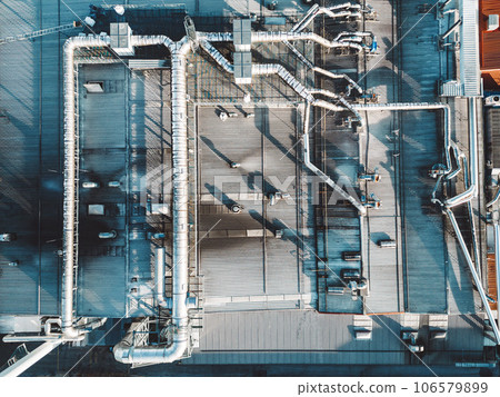 Top down view of pipes going across the roof top of logistics center Top down view of pipes going across the roof top of logistics center 106579899
