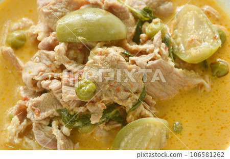 spicy boiled slice pork meat with eggplant in coconut milk green curry soup on plate spicy boiled slice pork meat with eggplant in coconut milk green curry soup on plate 106581262