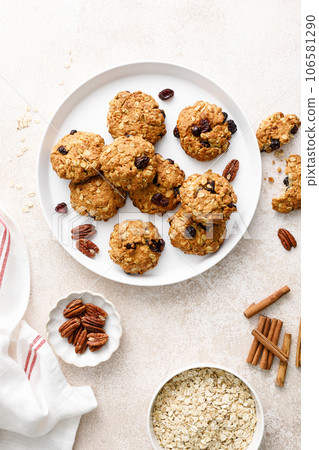 Oatmeal cranberry healthy homemade cookies with cinnamon and pecan nuts for breakfast Oatmeal cranberry healthy homemade cookies with cinnamon and pecan nuts for breakfast 106581290