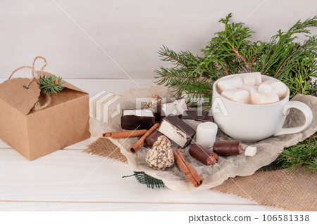 Christmas composition, cocoa with marshmallows on a white background, copy space 106581338