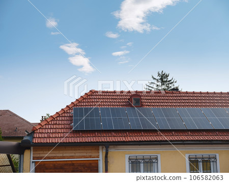 Solar photovoltaic panels on house roof Solar photovoltaic panels on house roof 106582063