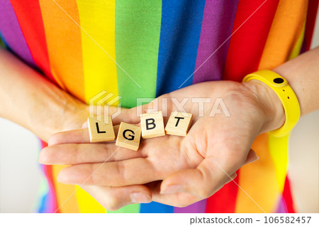 LGBT concept, same sex relationship and homosexual concept. The girl holds in her hands the letters with the inscription LGBT. Support, tolerance. LGBT concept, same sex relationship and homosexual concept. The girl holds in her hands the letters with the inscription LGBT. Support, tolerance. 106582457