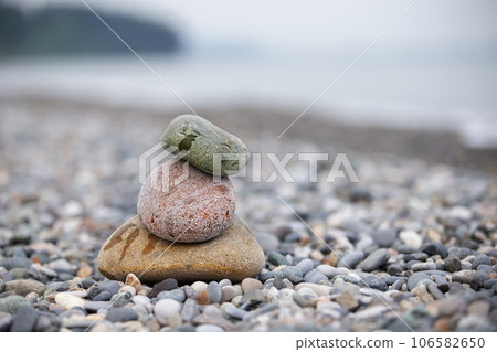 Pebbles on the seashore, large and small stones on the sea. Pebbles on the seashore, large and small stones on the sea. 106582650