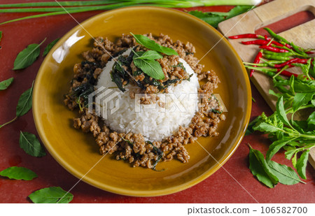 Minced pork with basil over rice is a Thai food that is popular among Thai people because it is delicious Minced pork with basil over rice is a Thai food that is popular among Thai people because it is delicious 106582700