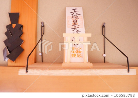 A substitute for a Shinto altar 2 bills placed on the wall shelf A substitute for a Shinto altar 2 bills placed on the wall shelf 106583798