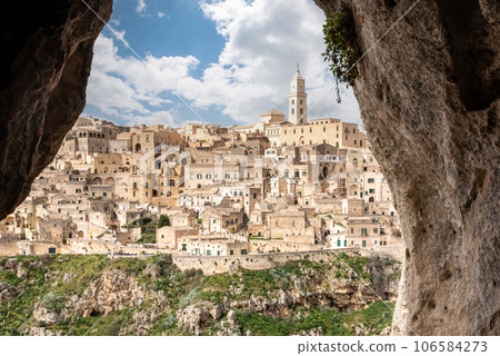 Scenic view of historic downtown with its cathedral, photo taken from a cave house, Southern Italy 106584273