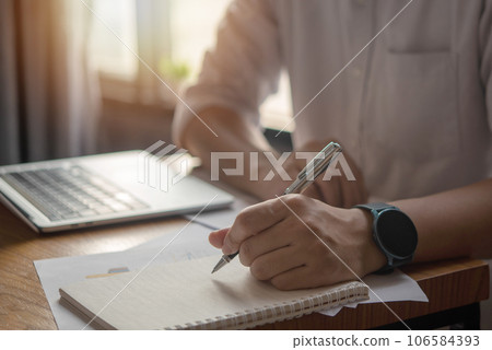 Hands Writing with Pen on Notebook. concept of work, study, and education. 106584393