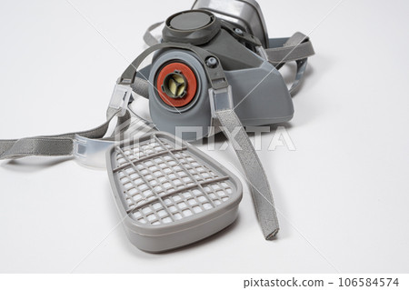 Respirator with dust and gas filters on a white background. Respirator with dust and gas filters on a white background. 106584574