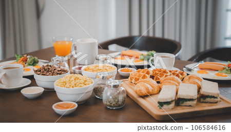 Breakfast served food with beverage coffee, orange juice on table in the morning at home, Fresh and bright continental breakfast healthy Breakfast served food with beverage coffee, orange juice on table in the morning at home, Fresh and bright continental breakfast healthy 106584616