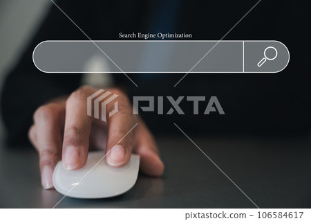 Technology Search Engine Optimization SEO. Business man holding white mouse on hand and 3D blank search bar, Searching internet browsing networking for data information, clicking internet 106584617