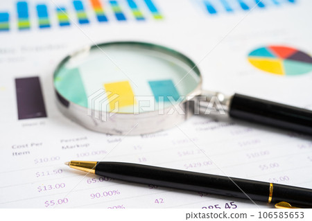 Magnifying glass on graph paper. Financial development, Banking Account, Statistics, Investment Analytic research data economy, Business concept. Magnifying glass on graph paper. Financial development, Banking Account, Statistics, Investment Analytic research data economy, Business concept. 106585653