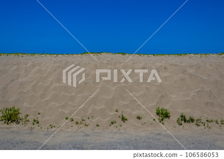 Abstract view of sand dune and summer blue sky, Kanaiwa, Kanazawa, Ishikawa Prefecture, Japan. Abstract view of sand dune and summer blue sky, Kanaiwa, Kanazawa, Ishikawa Prefecture, Japan. 106586053