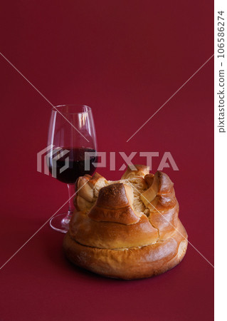 Portuguese cake Fogaca with Porto wine on red 106586274