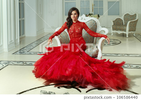 Perfect model woman wearing long red evening gown in luxurious interior, fashion beauty portrait Perfect model woman wearing long red evening gown in luxurious interior, fashion beauty portrait 106586440
