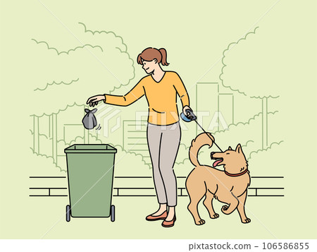Woman walking dog throws bag of puppy poop into trash can, taking care of cleanliness of park 106586855