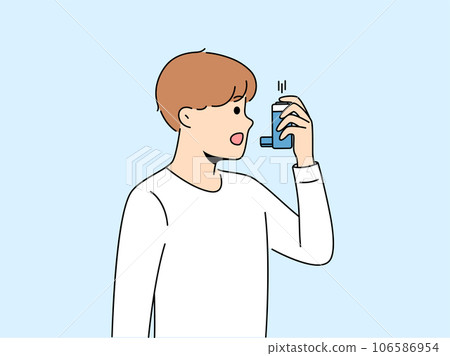 Boy uses inhaler to treat asthma attack due to difficulty breathing and lung disease 106586954