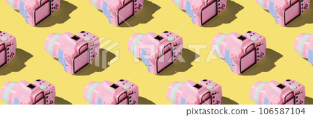 Pattern with SLR camera on pastel color background Pattern with SLR camera on pastel color background 106587104