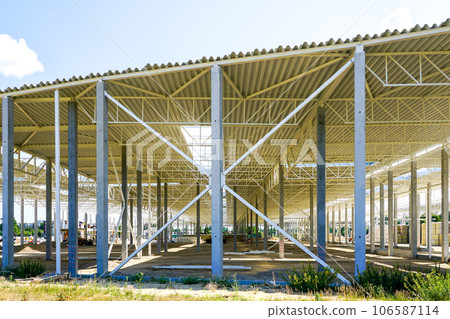 New large building steel framework with corrugated steel roof on reinforced concrete supports New large building steel framework with corrugated steel roof on reinforced concrete supports 106587114
