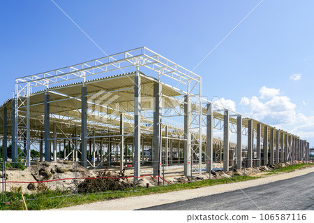 New large building steel framework with corrugated steel roof on reinforced concrete supports 106587116