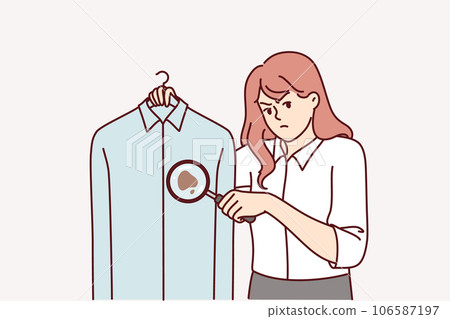Woman detective holds shirt with blood stain, using magnifying glass to investigate crime Woman detective holds shirt with blood stain, using magnifying glass to investigate crime 106587197