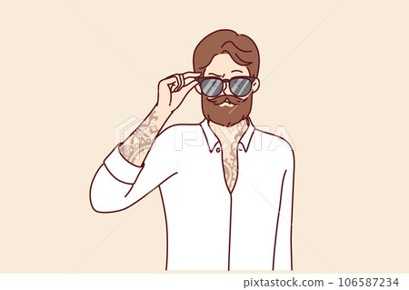 Hipster man with trendy beard and mustache puts on sunglasses and has tattoo on chest and arms Hipster man with trendy beard and mustache puts on sunglasses and has tattoo on chest and arms 106587234
