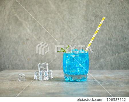 blue lemonade in a glass with ice blue lemonade in a glass with ice 106587312