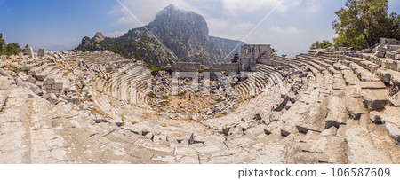 Woman tourist in the center of the circle explores Stunning Ancient Theater of Termessos Ancient City turkiye, GO Everywhere Woman tourist in the center of the circle explores Stunning Ancient Theater of Termessos Ancient City turkiye, GO Everywhere 106587609