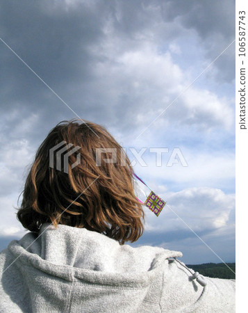 kite flying on a windy summer day kite flying on a windy summer day 106587743