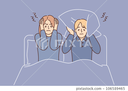 Man and woman suffering from insomnia sit in bed and cover ears with pillow due to noisy neighbors 106589465