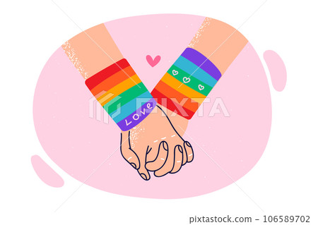 Hands of LGBT lovers in rainbow bracelets, for concept problems tolerance towards gays and lesbians 106589702