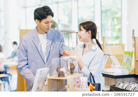Couple shopping at a select shop Couple shopping at a select shop 106591727