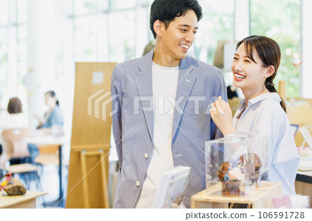 Couple shopping at a select shop Couple shopping at a select shop 106591728