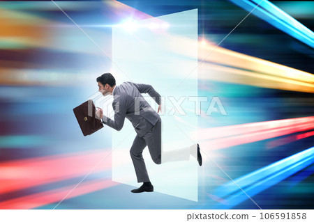 Businessman entering virtual world in business concept Businessman entering virtual world in business concept 106591858