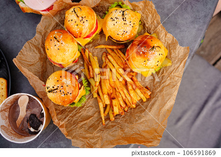 french fries and Mini burgers for a children's party or picnic.  106591869