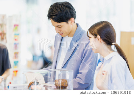 Couple shopping at a select shop Couple shopping at a select shop 106591918