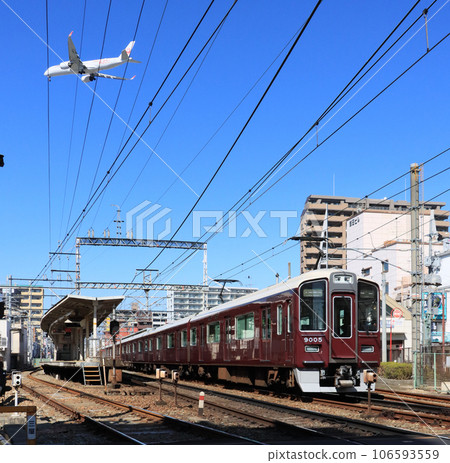 Trains and planes at Shonai Station on the Hankyu Takarazuka Line Trains and planes at Shonai Station on the Hankyu Takarazuka Line 106593559