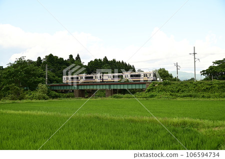 Tohoku Main Line running through paddy fields Tohoku Main Line running through paddy fields 106594734