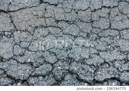 old broken road with cracked asphalt old broken road with cracked asphalt 106594770