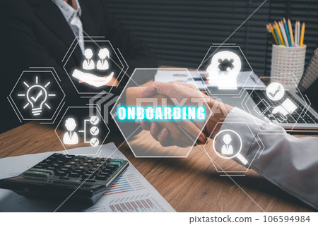 Business onboarding concept, Business partnership handshaking after perfect deal with onbaording icon on virtual screen background, Organizational, socialization. Business onboarding concept, Business partnership handshaking after perfect deal with onbaording icon on virtual screen background, Organizational, socialization. 106594984