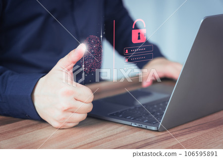 Young man log in with fingerprint scanning technology in the computer laptop. Secure encryption and access to the user's private information to access the internet. 106595891