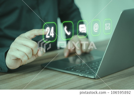 Client man using computer laptop with the virtual screen with apps the call phone, email, address, chat message and 24 hour icons. Customer support hotline contact us people connection concept. 106595892