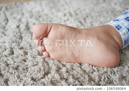 close up of 5 years old child dry feet on a carpet close up of 5 years old child dry feet on a carpet 106598064