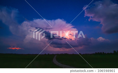 Thunderstorm at night with Milky way moving across the sky Thunderstorm at night with Milky way moving across the sky 106598901