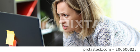 Confused and upset woman looking at computer screen 106600825