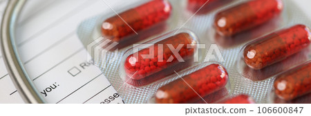 Blank sheet of patients medical form with stethoscope and pills 106600847