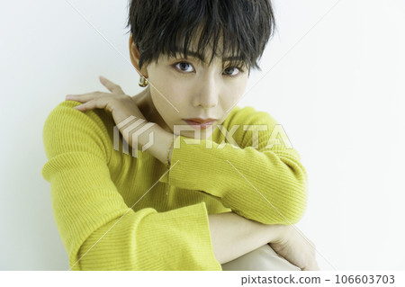 Fashion portrait of young woman in yellow clothes on white background Fashion portrait of young woman in yellow clothes on white background 106603703