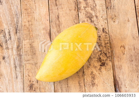 Mango fruit on old wooden table Mango fruit on old wooden table 106603933